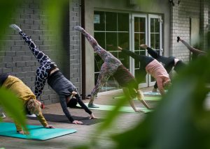 group doing yoga outside
