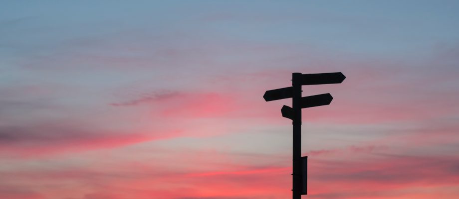 road sign at sunset